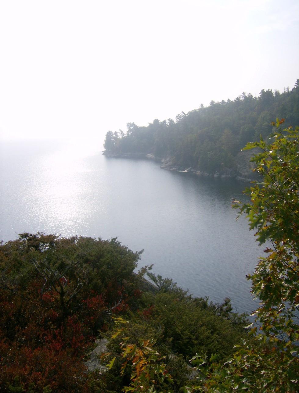 The view of a lake bay from on top of a cliff