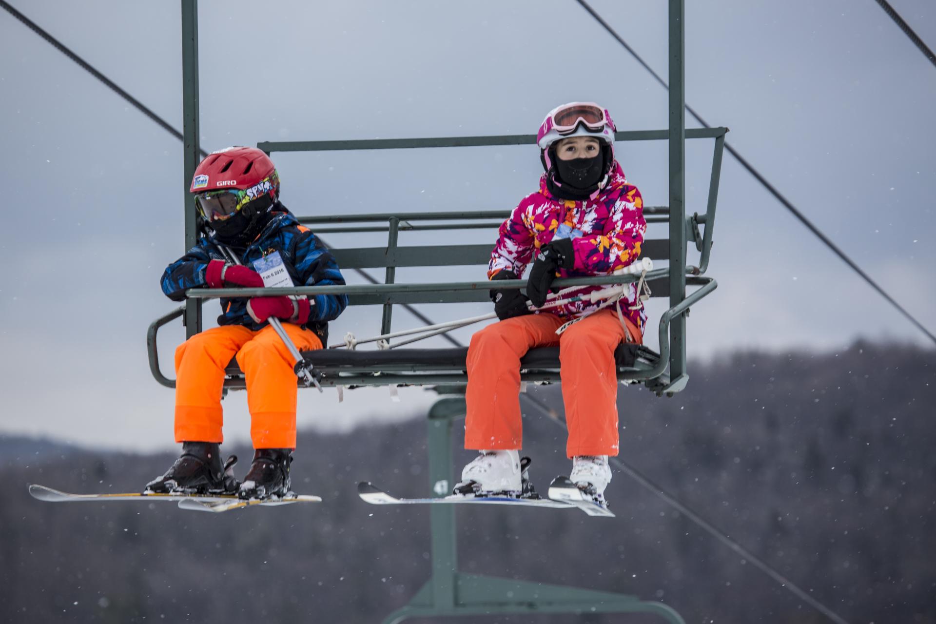 Two kids on a chair lift at Titus