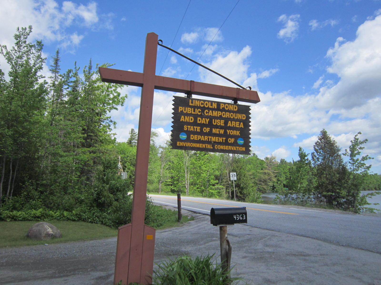 A large wooden sign for Lincoln Pond Campground