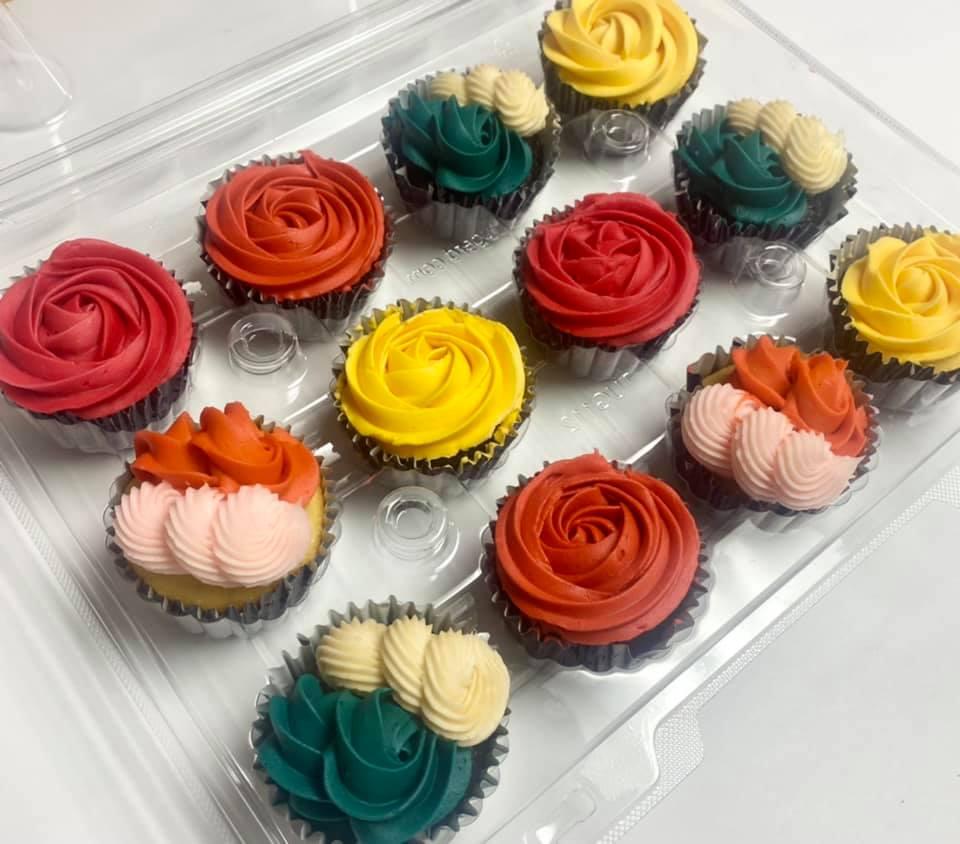 Cupcakes decorated with colorful icing shaped like flowers