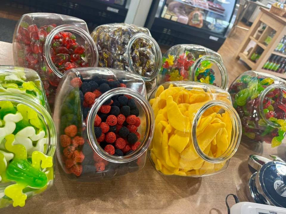 Colorful candies in glass jars at K & D Deli