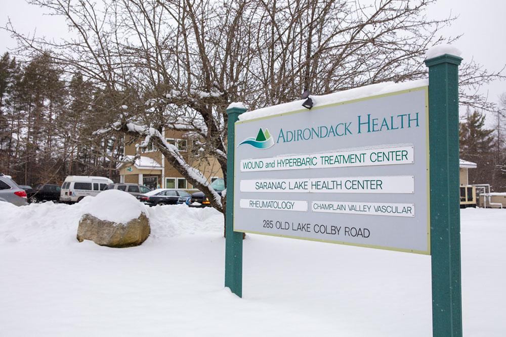 Entry sign with doctor names at the front of the Saranac Lake Health Center