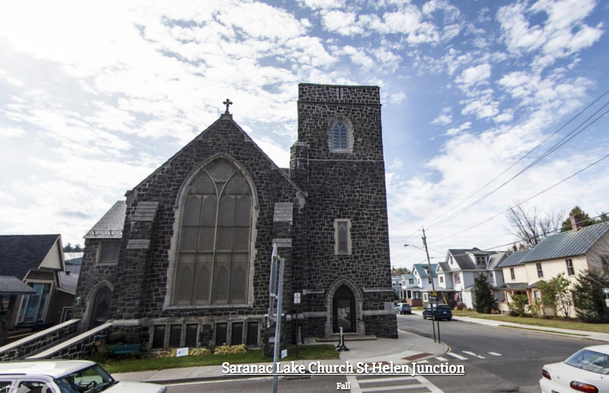 Exterior of the tall grey stone church
