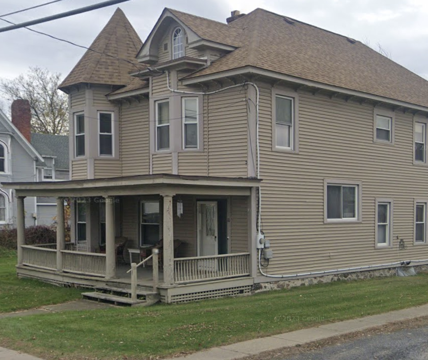 Brown Vinyl exterior of a church outbuilding