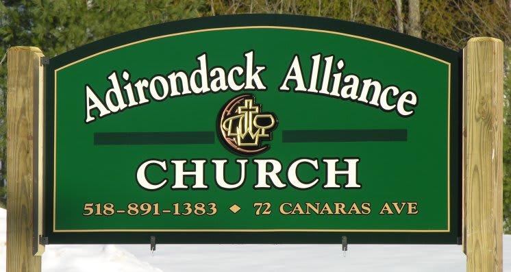 Green sign for the adirondack alliance church