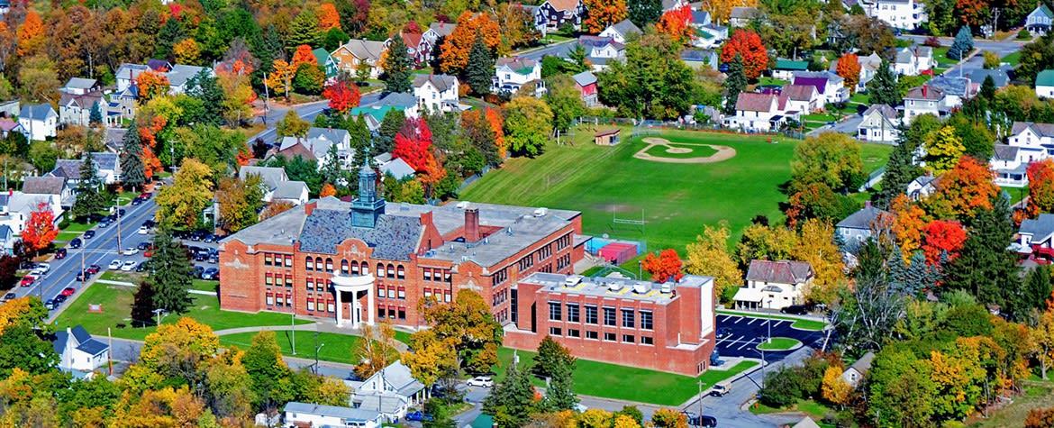 Areal view of the brick school and athletic fields behind