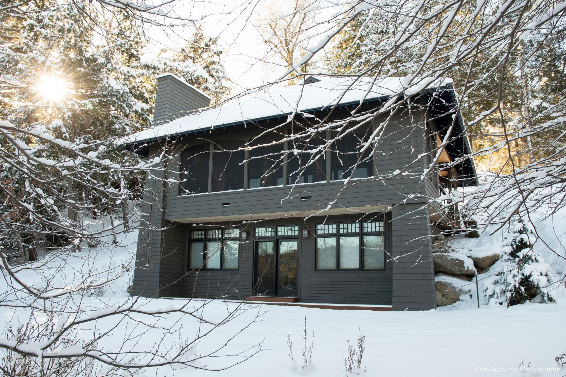 The all wood interior of a dining space.