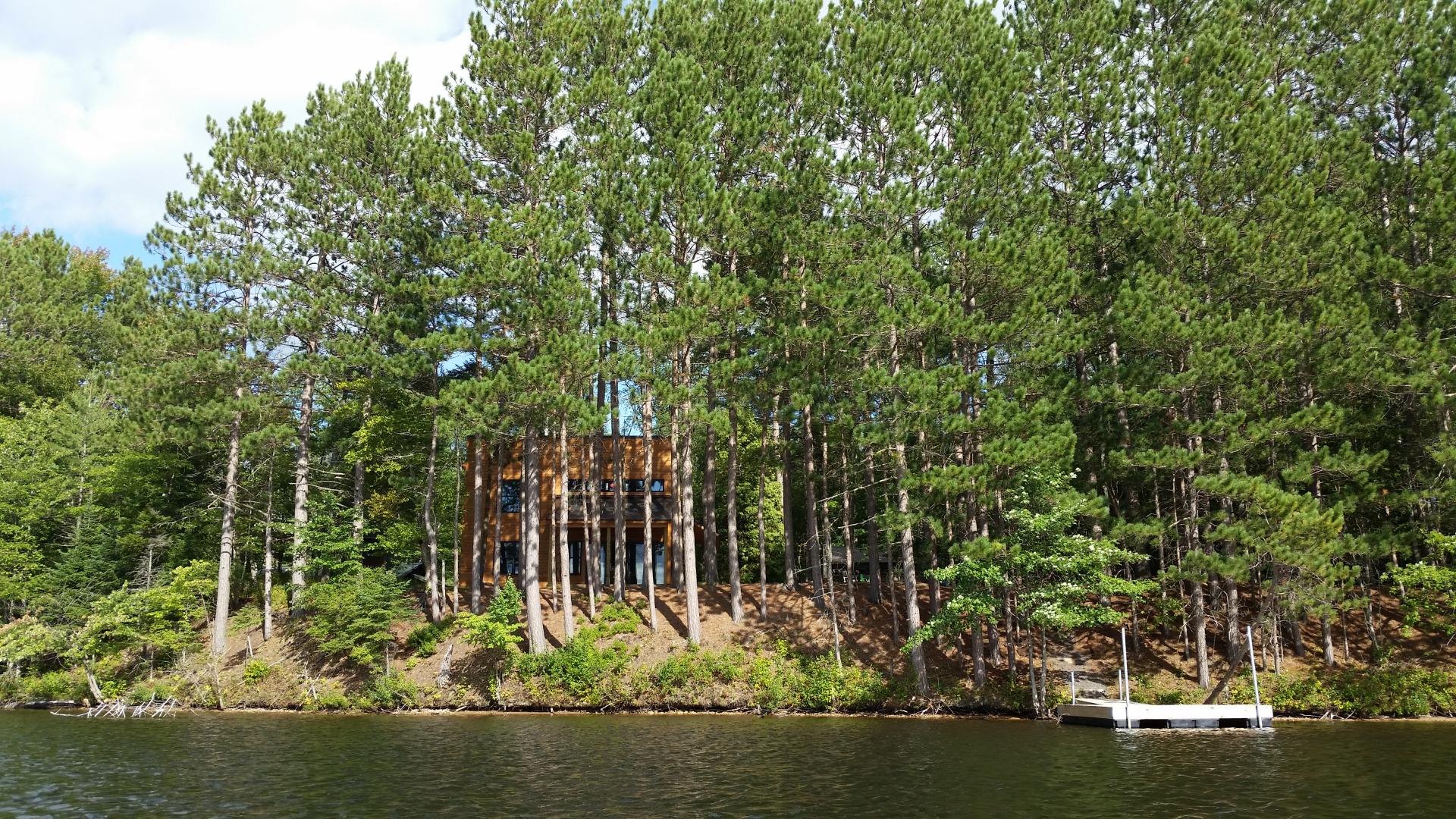 A modern home shrouded in fresh snow.