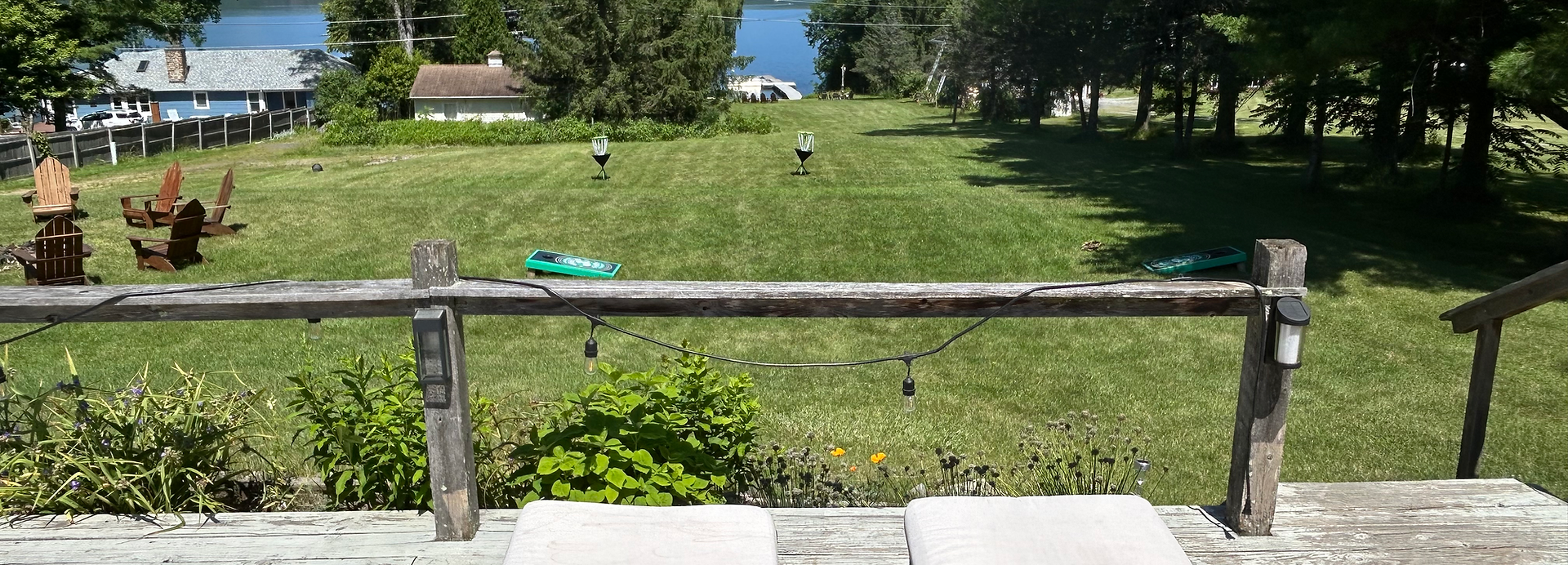 A sprawling lawn overlooking the water of Lake Champlain.