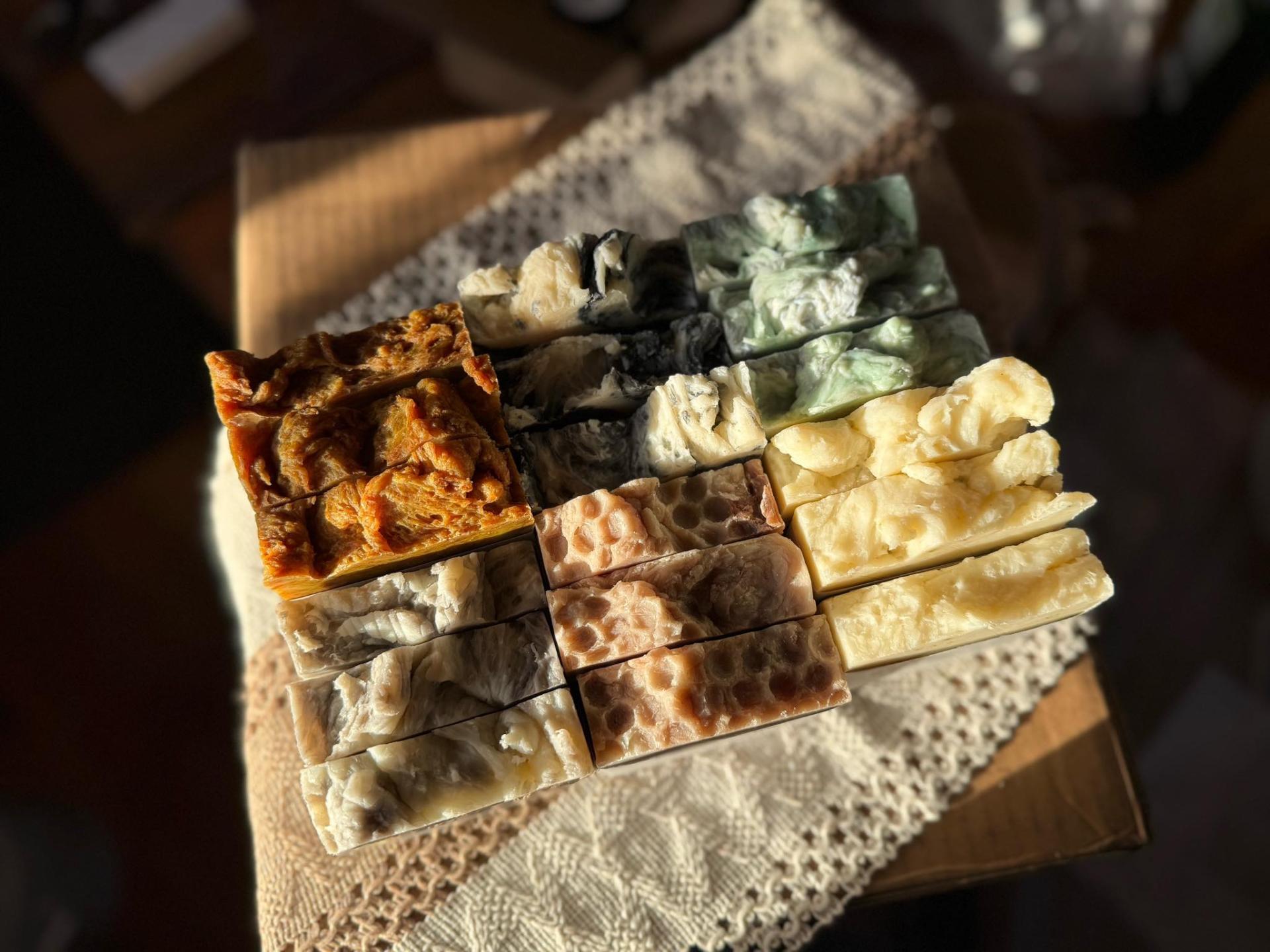 Soap on a wooden table titled balsam and bourbon.