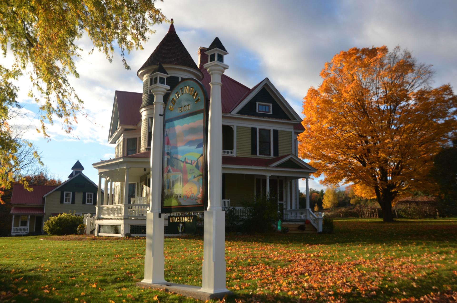 The front entry sign with the historic home in the background.