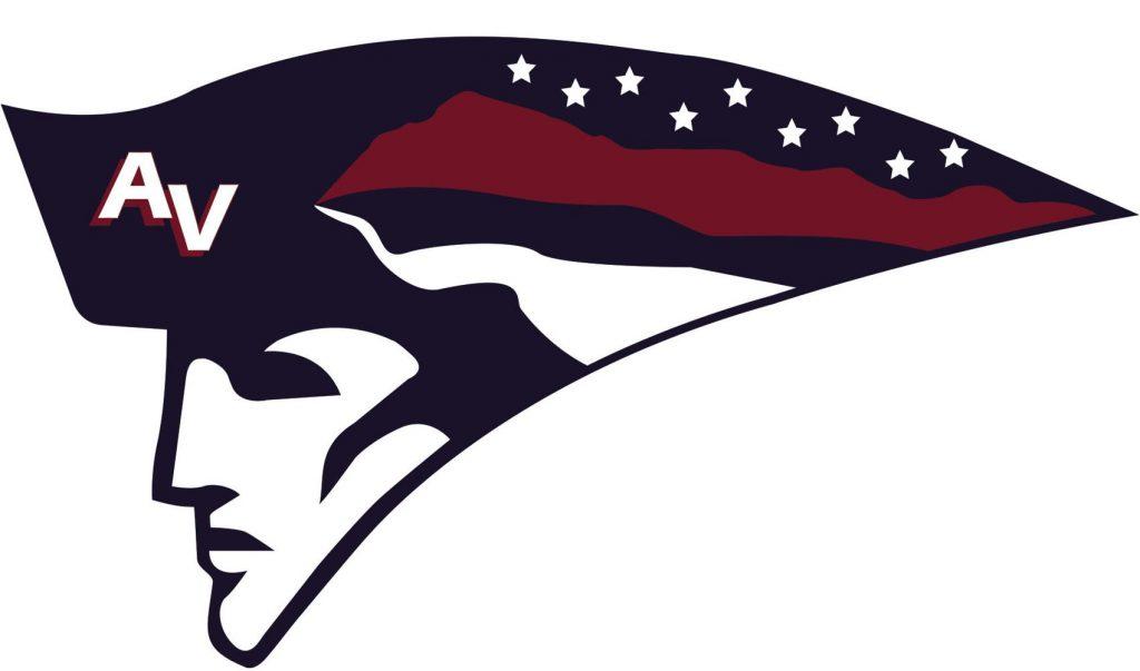 A profile of a man wearing a colonial hat with red