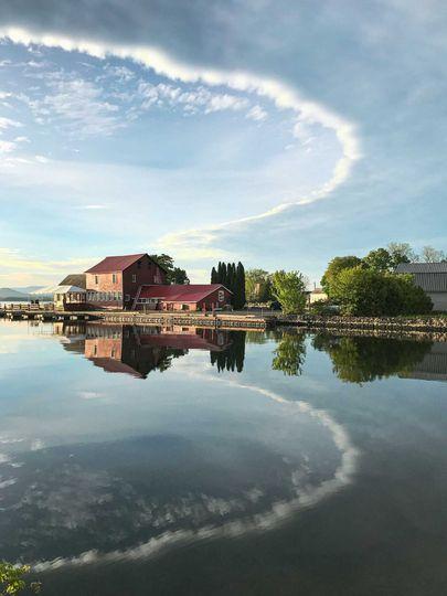 Looking from the Ferry loading dock towards the Old Dock Restaurant on a perfectly still day where the water reflects the sky