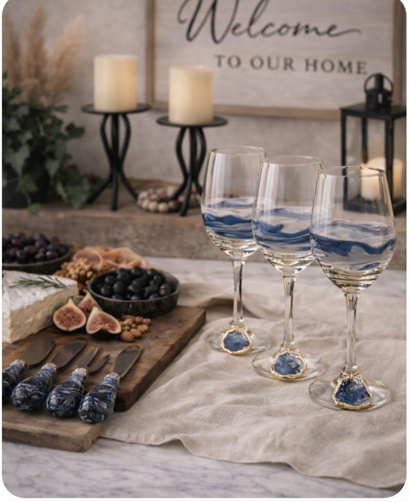 Blue glass cheese knives and wine glass charms.