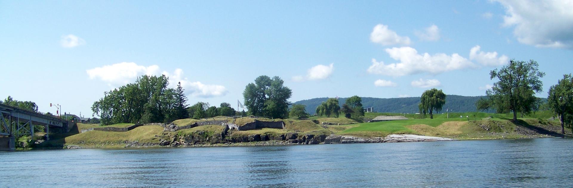 The view from the lake shows off the extensive grounds of Crown Point State Historic Site.